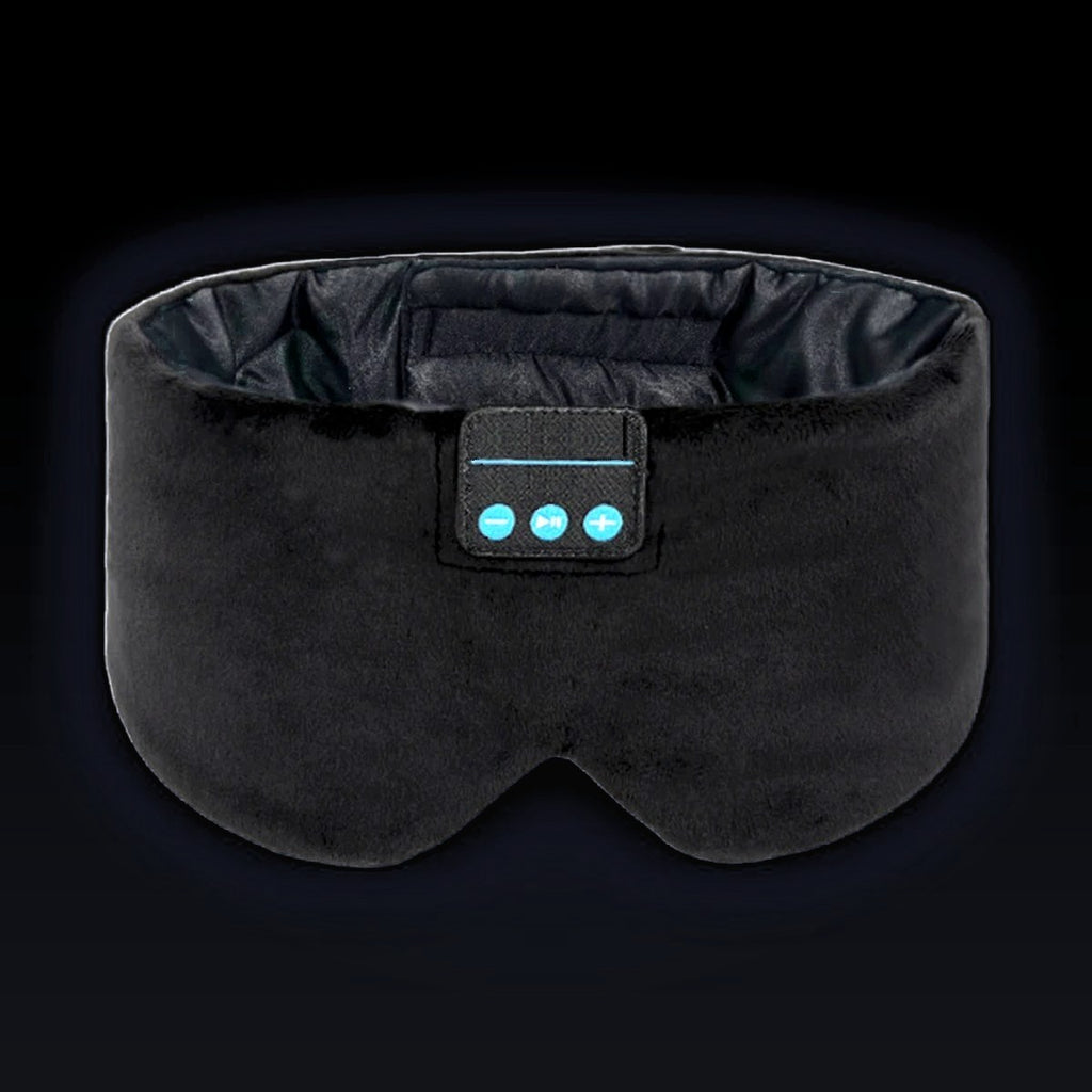 The Dual-Clearance Sleep Mask in Midnight Black, front on: wide black velvet band, two molded eye cups, dark satin lining inside and the three-button control panel.
