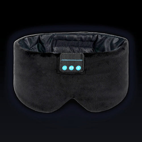 The Dual-Clearance Sleep Mask in Midnight Black, front on: wide black velvet band, two molded eye cups, dark satin lining inside and the three-button control panel.