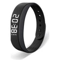 The Silent Wake Band in black: a slim silicone wristband with a white LED time display.